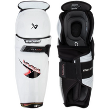 Load image into Gallery viewer, Pair of Bauer hockey shin guards on a white background
